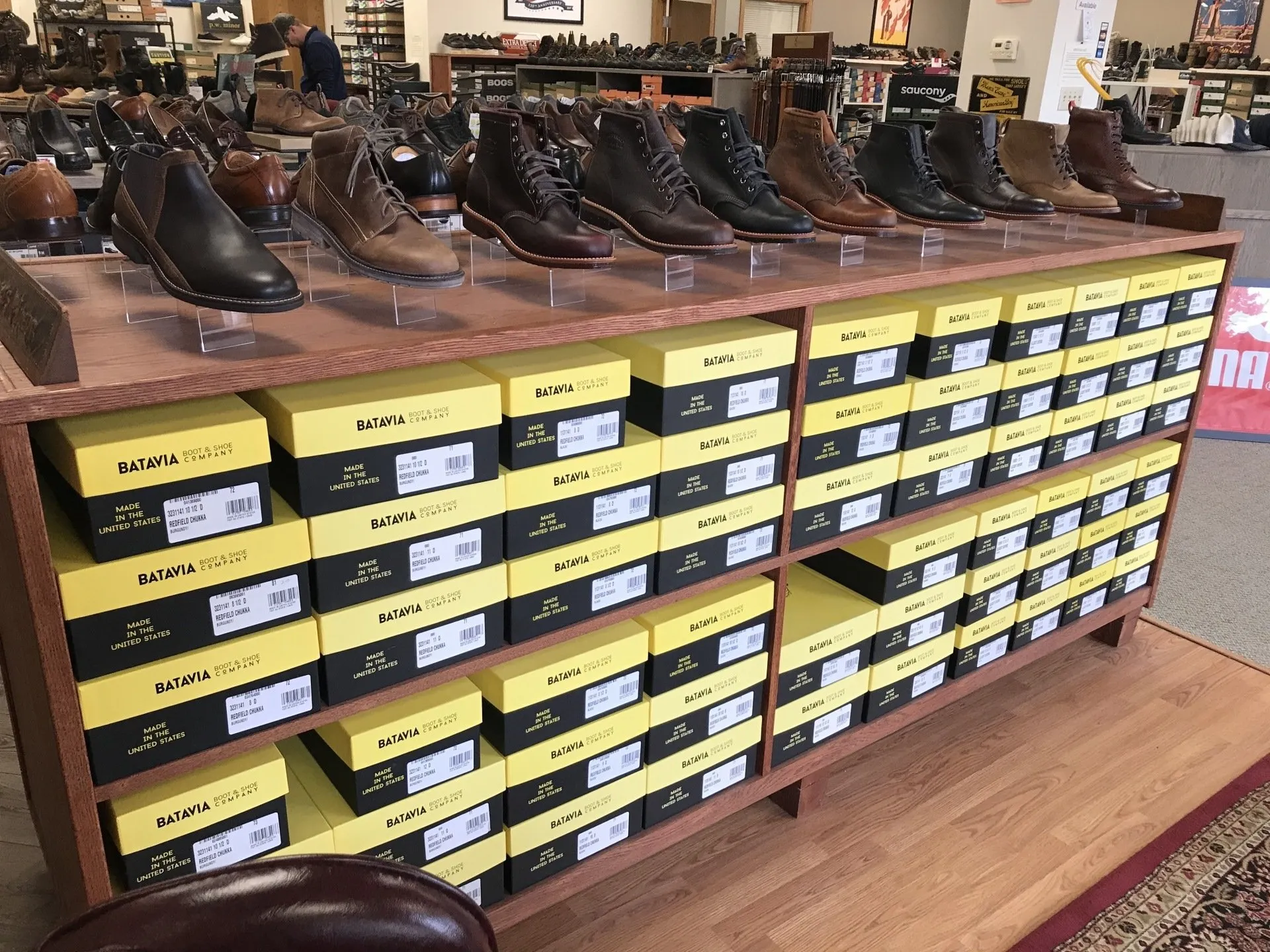 Row of leather boots on a display shelf