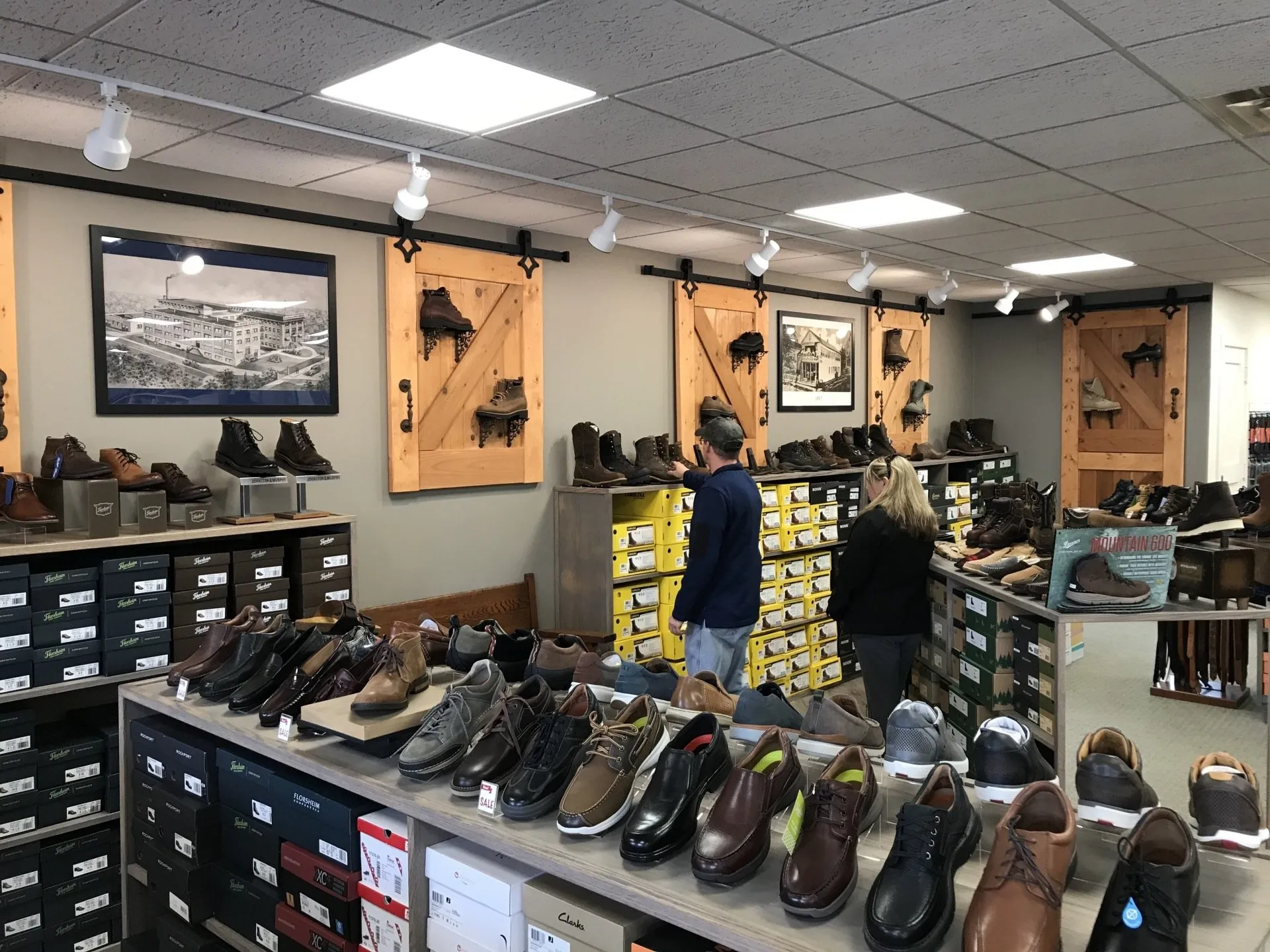 Customers browsing Luke's Bootery interior